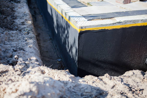 Professional Basement Waterproofing technician working in Plainfield, IN